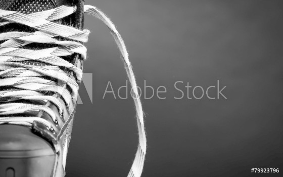 Picture of Half of a hockey skate on black